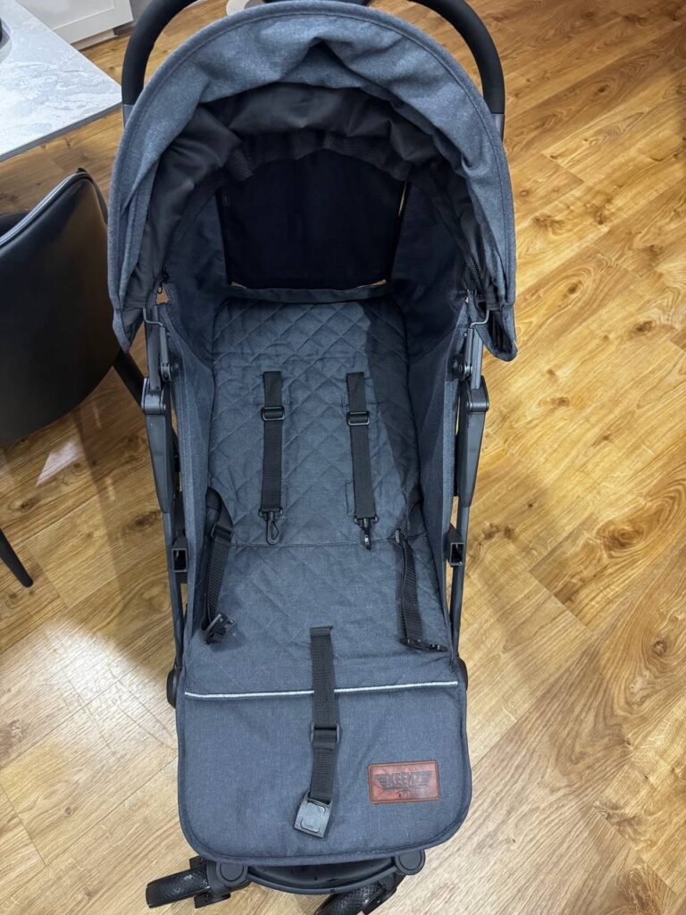 Professional cleaning of a baby stroller seat and frame in Singapore